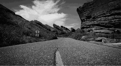 An empty road with a view of mountains
